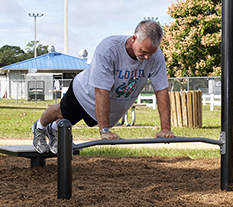 Man doing Push Ups at an Outdoor Fitness Park