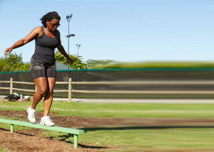 Woman Working out on a Balance Beam