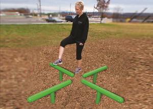 Woman working out on a Log Hop at an Outdoor Fitness Park